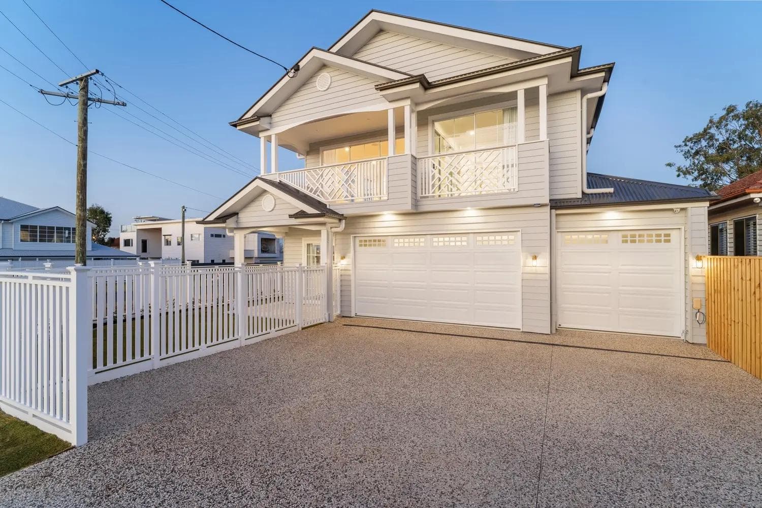 A corner block house design featuring garage access on the secondary street to preserve the primary home facade.