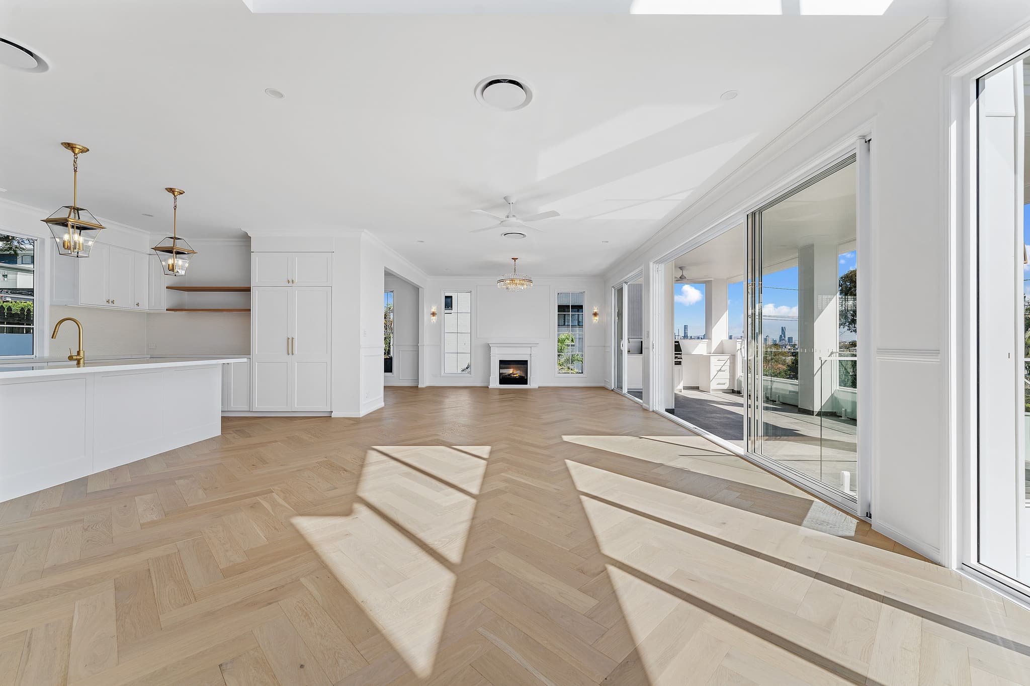 A custom home in Brisbane demonstrating ideal house orientation, natural light, and shaded outdoor living areas.