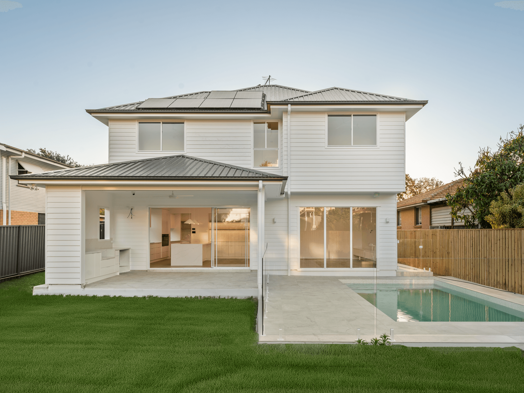 Covered alfresco with ceiling fan opening directly onto the pool at a Flascon-built Brisbane home