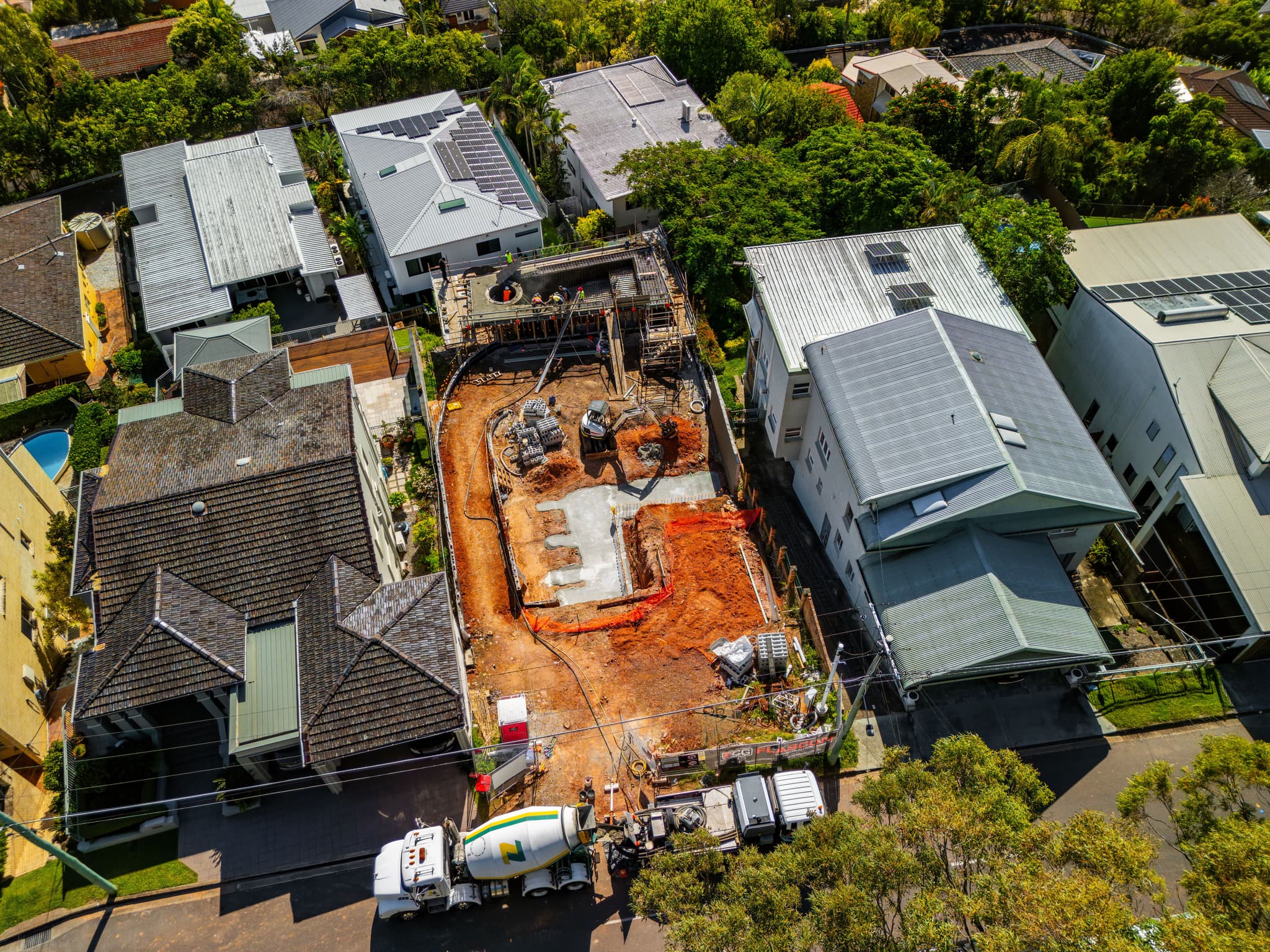 Aerial view of a slab pour on a Flascon Construction Group site, with the concrete pump reaching the rear of a tight inner-suburban block