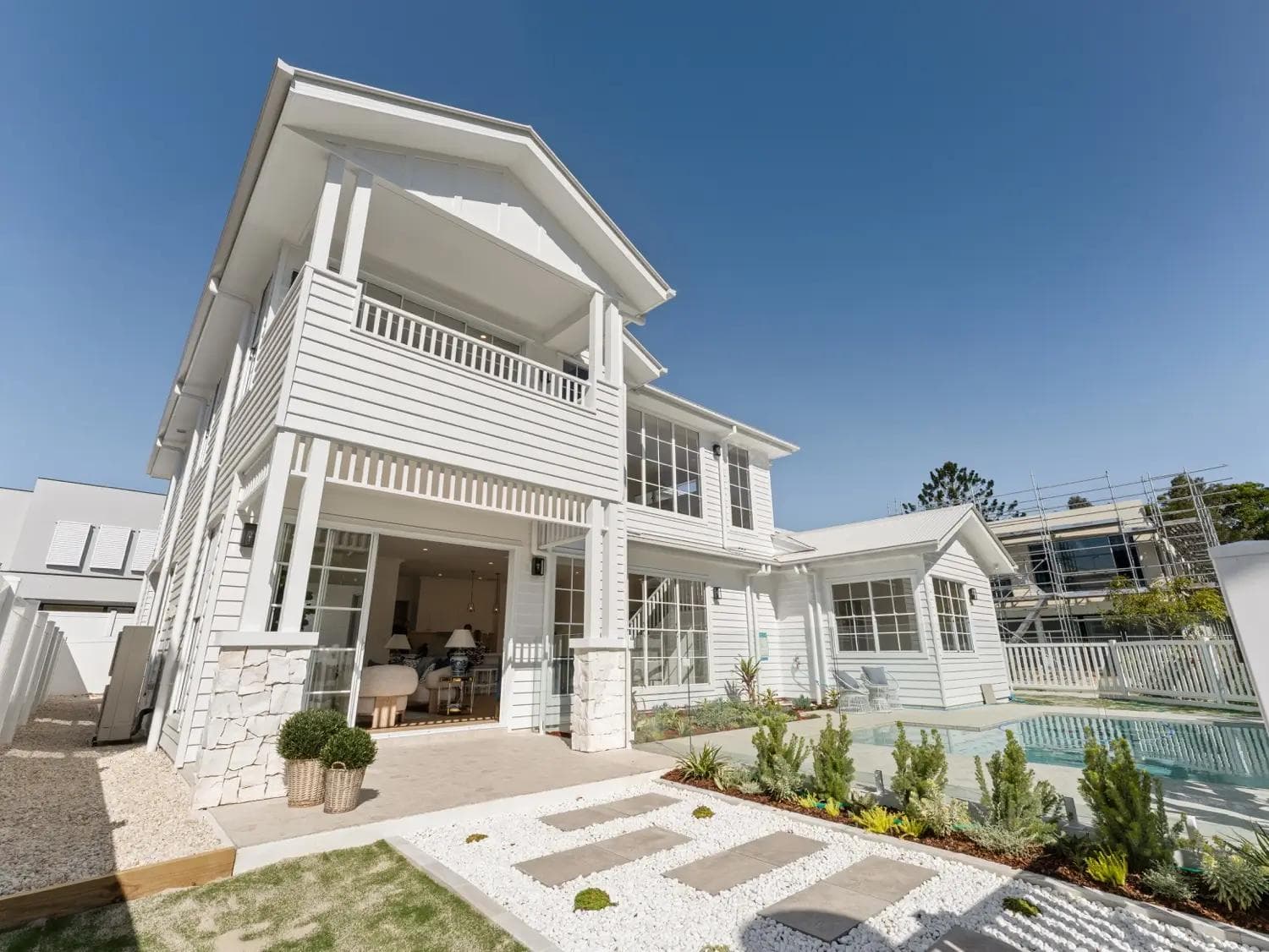 A modern two storey house in brisbane with a Hamptons inspired facade