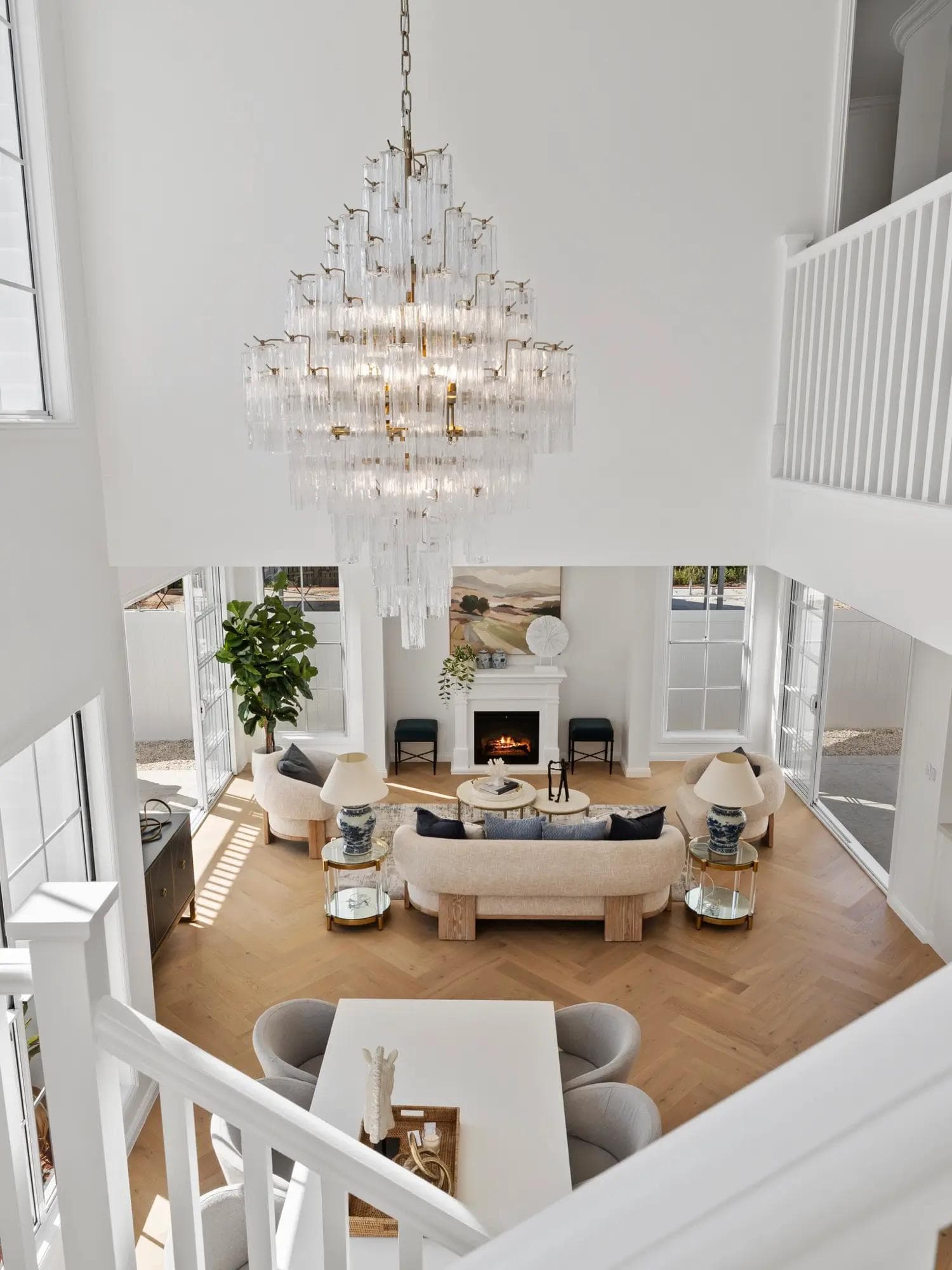 An open plan living and dining area with a grand ceiling height